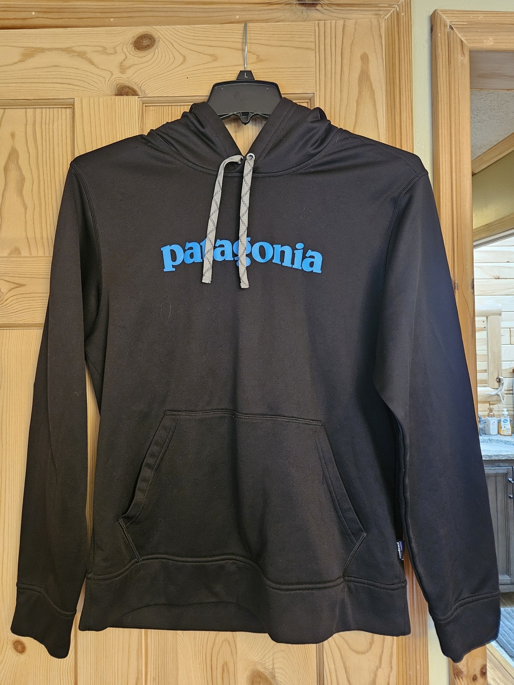 Patagonia Black Hoodie with Bright Blue Logo